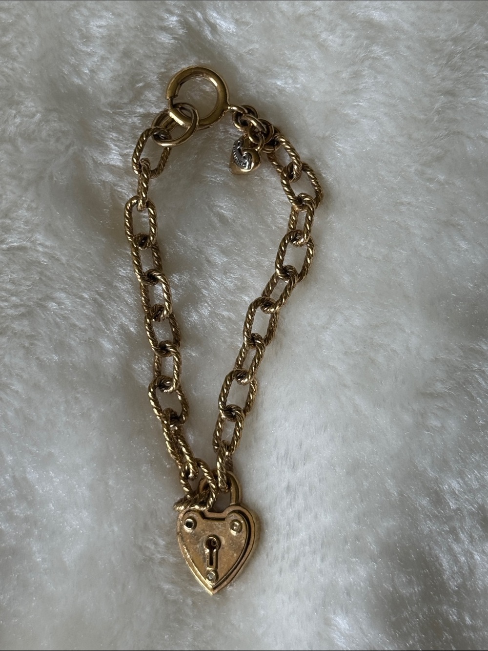 Juicy Couture padlock heart charm bracelet featuring a textured link chain